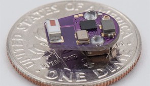 Miniaturized implantable temperature sensor on a US dime.