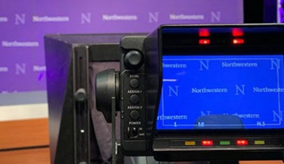 television studio with camera pointing at Northwestern backdrop