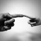 Two hands touching each other