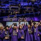 Graduating students tossing their graduation caps