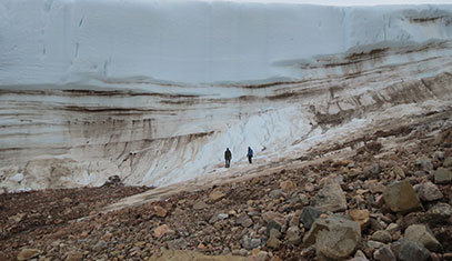 Team hiking near ice sheet