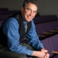 Peter Civetta, Director of Undergraduate Research, smiling into the camera