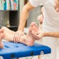 Man getting acupunture in his foot.