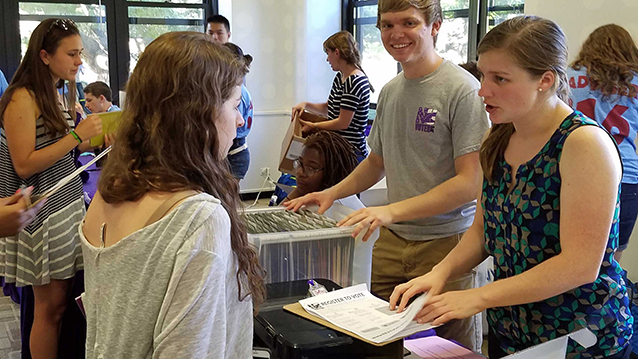 Students registering other students to vote.