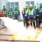 A man puts out a fire with a fire extinguisher