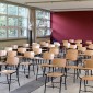 A photo illustration showing empty seats in a classroom