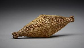 Biconical bead, Egypt or Syria, 10th -11th century Gold; filigree, granulation, "rope" wire L. 7.2 cm, H. 2.9 cm, The Aga Khan Museum, AKM618.