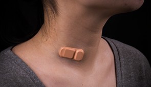 Band-aid-like wearable shunt monitor, as seen on woman's neck