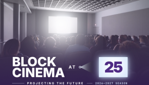 Audience in the darkened Block Cinema auditorium with bright screen and anniversary logo