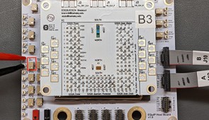 Packaged circuit board containing the chip used in the experiments.