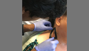 Dr. Ayer applies sensor to patient