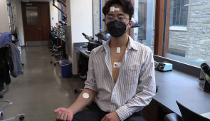 Volunteer showing the full "body-area network" with all devices.
