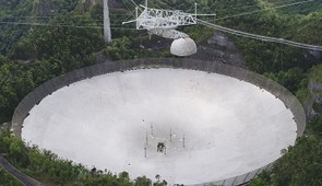 The Arecibo Telescope in Puerto Rico. Nineteen of the pulsars that NANOGrav currently monitors were initially found with Arecibo. Credit: Arecibo Observatory, a facility of the National Science Foundation