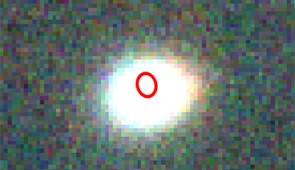 Close-up of the inset, showing where the explosion (red circle) occurred within its galaxy (bright smudge).