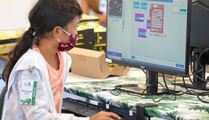 A student explores Battery-free MakeCode in the classroom.
