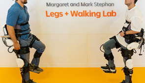 therapist and patient wearing exoskeletons