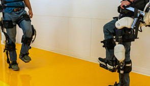 therapist and patient wearing exoskeletons