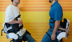 therapist and patient wearing exoskeletons
