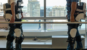 therapist and patient wearing exoskeletons