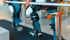 therapist and patient wearing exoskeletons