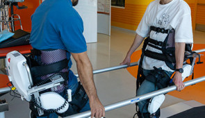 therapist and patient wearing exoskeletons