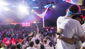 Exhausted dancers hug at the finale of Northwestern University Dance Marathon 2019. Photo by Justin Barbin.