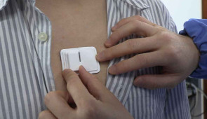 Close-up of the cardiac module, placed on the chest of a volunteer.