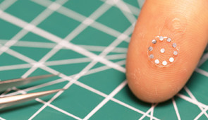 Sticker displayed on a fingertip
