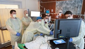 Dr. Brian Garibaldi and colleagues examine a patient at Northwestern Medicine. 