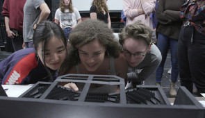 ‘Fun Home’ cast members view a model of the set at the first rehearsal. Photo by Stephen Lewis.