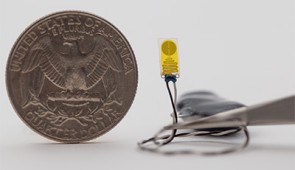 The entire electronic system is smaller than a quarter.