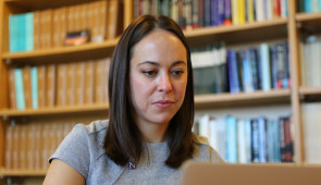 Dr. Gabrielle Liu examines a CT scan on her laptop. 