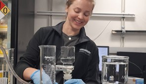 Gabriella Kitch filters water in the lab.