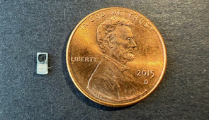 Pacemaker next to a penny for scale.