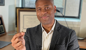 Guillermo Ameer holds an electronic regenerative bandage.
