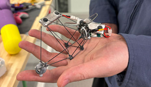 low-visibility drone in hand
