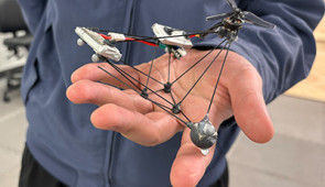 low-visibility drone in hand