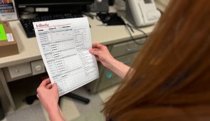 A study participant looks at the results from their InBody scan.