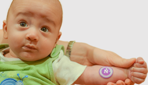 A healthy infant models the device