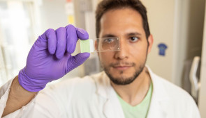 Northwestern University study co-author Ivan Ayala examines a SuperAger brain sample on a slide. (Credit: Shane Collins, Northwestern University)