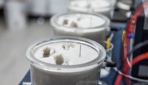 Samples of sand in Rotta Loria's laboratory. The vertical, silver posts are electrodes.