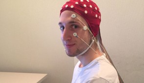 CAPTION: Christopher Y. Mazurek in a full EEG rig just before a sleep session in the lab. The electrodes on his face will detect the movement of his eyes as he sleeps.
CREDIT: C. Mazurek
