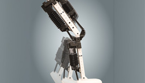 A composite image of the robotic leg — with integrated artificial muscles — bending at the ankle and knee.