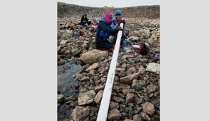The Northwestern team extracts a lake sediment core from Wax Lips Lake in northwestern Greenland.
Credit: Alex P. Taylor