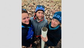 Northwestern’s Yarrow Axford (right) and two of her graduate students hold a lake sediment core, extracted from Wax Lips Lake in northwest Greenland.
Credit: Alex P. Taylor
