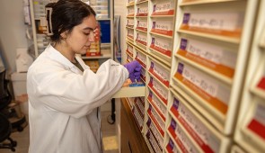 A lab member looks through SuperAger brain samples that have been fixed in blocks of wax for examination. (Credit: Shane Collins, Northwestern University)
