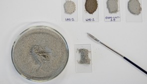 Various samples of lunar soil simulants in the lab.