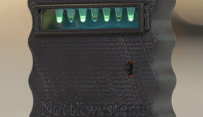 Water samples within the device glow green when a contaminant is detected.