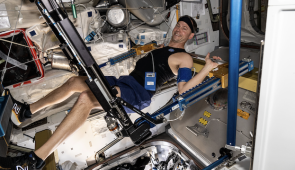 NASA astronaut Nick Hague exercises on the advanced resistive exercise device (ARED) aboard the International Space Station's Tranquility module.