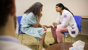 A medical student enrolled in Northwestern University Feinberg School of Medicine's simulation-based mastery learning course practices breaking bad news to a trained actor. The course train physicians to deliver bad news to patients in a clear and compassionate way.